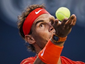 Rafael Nadal, of Spain, serves to Benoit Paire, of France, during second round Men's Rogers Cup tennis tournament action in Toronto, Wednesday, August 8, 2018. THE CANADIAN PRESS/Mark Blinch