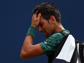 Novak Djokovic walks off the court after being beaten by Stefanos Tsitsipas 6-3, 6-7 (5), 6-3 at the Rogers Cup in Toronto on Thursday. GETTY IMAGES