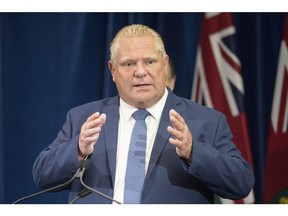 Ontario Premier Doug Ford stands at the podium during a press announcement at the Queens Park Legislature in Toronto on Thursday, August 9, 2018.THE CANADIAN PRESS/Chris Young ORG XMIT: chy103