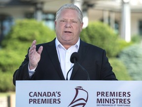 Ontario Premier Doug Ford talks with reporters as the Canadian premiers meet in St. Andrews, N.B. on Thursday, July 19, 2018.  THE CANADIAN PRESS/Andrew Vaughan