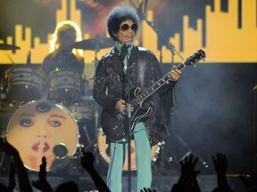 In this May 19, 2013, file photo, Prince performs at the Billboard Music Awards at the MGM Grand Garden Arena in Las Vegas.