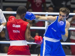 Canadian Arthur Biyarslanov (Blue) won gold over Yasnier Toledo of Cuba during Mens Boxing  Light Welter (64kg) Finals at the Pan Am Games at Oshawa Sports Center on July 24, 2015. Ernest Doroszuk/Toronto Sun