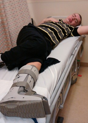 Riley Dooley is pictured in hospital after being treated for a shattered tibia and broken fibula. Handout photo