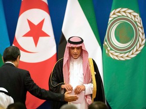 Saudi Arabia's Foreign Minister Adel al-Jubeir leaves the stage after speaking during the opening session of the 8th Ministerial Meeting of the China-Arab States Cooperation Forum in Beijing, Tuesday, July 10, 2018.