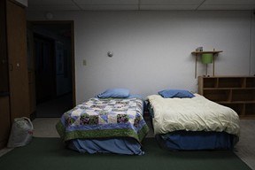 Ready-made beds are seen in a small basement classroom of the First Presbyterian Church in Plattsburgh, N.Y. The room is kept ready and available to asylum seekers who might need a place to stay before crossing the border. (Andre Malerba/The Washington Post)