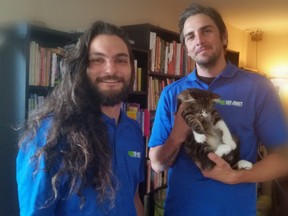 Nick, left and Dustin, (holding Sebastian, the kitten) from Got-Junk? successfully de-junked my condo