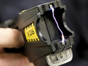 A close up of 50,000 volts arcing between the two terminals of a Taser X26 on May 14, 2015.