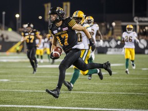 Ticats’ Luke Tasker runs in for a TD against the Eskimos last Thursday night in Hamilton.          (Mark Blinch/The Canadian Press)