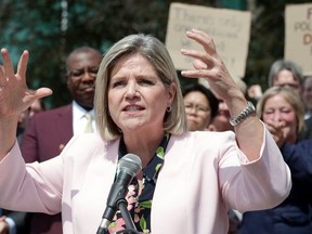 Ontario NDP leader Andrea Horwath gestures claw-like and says to her supporters,  that they have to " save your city from the claws of Doug Ford" , in front of Queen's Park that  in Toronto, Ont. on Thursday August 2, 2018. Stan Behal/Toronto Sun/Postmedia Network