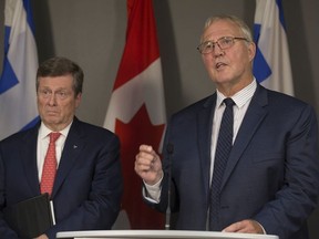 Mayor John Tory and Minister of Border Security and Organized Crime Reduction , Bill Blair speak to the media at a press conference at Toronto City Hall in Toronto, Ont. on Friday August 3, 2018. Stan Behal/Toronto Sun/Postmedia Network
