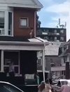 A toddler was rescued by a stranger after wandering out onto a second-floor rooftop of a house in Hamilton on Wednesday, August 8, 2018. (6ixbuzz/Facebook)