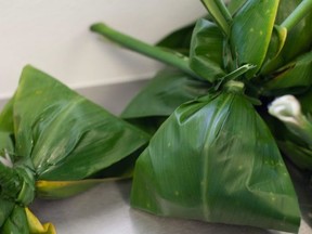 Lau lau, little packets stuffed with savoury goodness, are one of the many Hawaiian dishes made by hand at Highway Inn in Honolulu. PHOTO COURTESY HIGHWAY INN