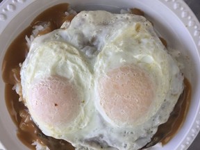 The oddly named loco moco — a scoop of rice, topped with a beef burger, topped with mushroom gravy, topped with two fried eggs — at Hawaii’s Favorite Kitchens. ROBIN ROBINSON/POSTMEDIA NETWORK