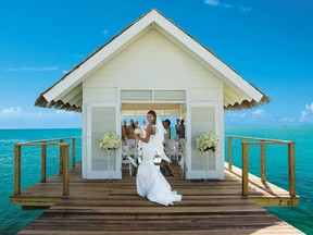 Not everyone can stay in an overwater bungalow, but every couple getting married at the resort can tie the knot in the sweet little overwater chapel and walk down the overwater aisle. SANDALS RESORTS PHOTO