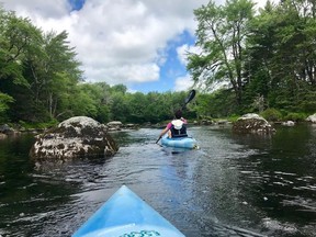 Student naturalist Nora Alsafi leads a kayaking outing on the Tusket River, one of the many recreational outings available at Trout Point Lodge in southwest Nova Scotia.