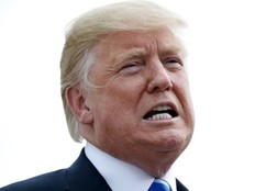 U.S. President Donald Trump pauses while speaking to the media as he steps off Air Force One, Tuesday, Aug. 21, 2018, in Charleston, W.Va.