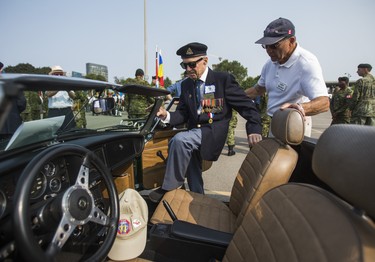 World War II veteran Al Stapleton is helped into a convertible MG that will be driven in the WarriorsÕ Day Parade at the CNE in Toronto, Ont. on Saturday August 18, 2018. Ernest Doroszuk/Toronto Sun/Postmedia