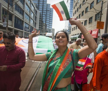 Waving the flag at the India Day Festival and Grand Parade along Dundas St. W. in downtown Toronto, Ont. on Sunday August 19, 2018. Ernest Doroszuk/Toronto Sun/Postmedia