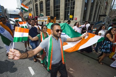 Waving the flag at the India Day Festival and Grand Parade along Dundas St. W. in downtown Toronto, Ont. on Sunday August 19, 2018. Ernest Doroszuk/Toronto Sun/Postmedia