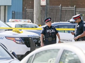 Two knives lie in the middle of the road after a 30-year-old man is dead from a stabbing located at Weston Rd and Lawrence Ave on Friday August 24, 2018. Veronica Henri/Toronto Sun/Postmedia Network