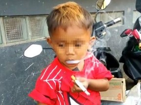 Rapi Pamungka smokes 40 cigarettes a day and his dim-witted mother doesn’t have the heart to make the pint-sized puffer quit. He is two-years-old.