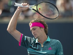 Alexander Zverev reacts during his loss to Stefanos Tsitsipas of Greece during their Rogers Cup quarterfinal match on Friday. THE CANADIAN PRESS