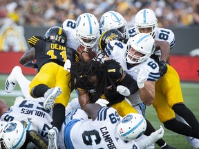 Toronto Argonauts quarterback James Franklin keeps the ball for a touchdown against Hamilton on Monday. (THE CANADIAN PRESS)