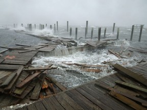 Portions of a boat dock and boardwalk are destroyed by powerful wind and waves as Hurricane Florence arrives September 13, 2018 in Atlantic Beach, N.C. (Chip Somodevilla/Getty Images)