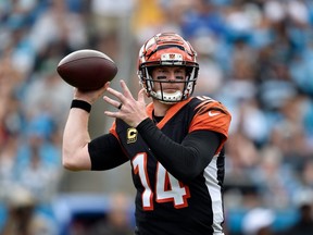 Andy Dalton #14 of the Cincinnati Bengals throws a pass against the Carolina Panthers in the second quarter during their game at Bank of America Stadium on September 23, 2018 in Charlotte, North Carolina.  (Photo by Grant Halverson/Getty Images)