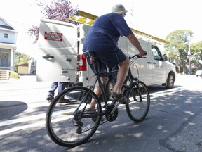 A cyclist uses the Woodbine bike lanes. (Jack Boland, Toronto Sun)