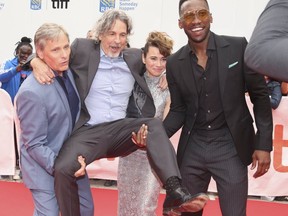 Director Peter Farelly gets lifted up by actors Viggo Mortensen (L), Linda Cardellini and Mahershala Ali at the TIFF screening of Green Book at Roy ook at the Roy Thomson Hall theatre on Sept. 11, 2018. (Jack Boland, Toronto Sun)