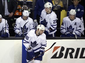 Leafs' defencemen (from left) Ron Hainsey, Nikita Zaitsev, Roman Polak (no longer with team), Travis Dermott and Morgan Rielly sit on the bench during the playoffs last season. (AP PHOTO)