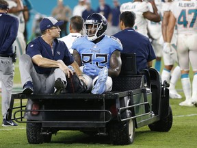 Tennessee Titans tight end Delanie Walker is driven off the field after he injured his leg last week. (AP PHOTO)