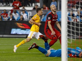 Toronto FC’s Michael Bradley (centre) and Alex Bono react as Tigres UANL’s Jesus Duenes scores on Wednesday night. (GETTY IMAGES)