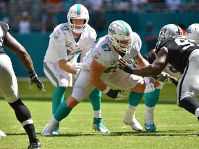 Ryan Tannehill and the undefeated Miami Dolphins head to New England on Sunday. (GETTY IMAGES)