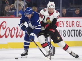 Ottawa Senators' Gregor MacLeod challenges Toronto Maple Leafs' Adam Brooks at the NHL Rookie Showdown in Laval, Que., yesterday. (The Canadian Press)