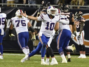 Bills quarterback AJ McCarron (10) celebrates a game-winning touchdown throw against the Bears during second half NFL preseason action in Chicago, Aug. 30, 2018.