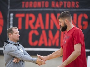 Raptors' Jonas Valanciunas shakes hands with head coach Nick Nurse during a team practice in Burnaby, B.C. Wednesday, Sept. 26, 2018. (THE CANADIAN PRESS)