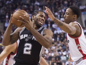 Kawhi Leonard (left) has big shoes to fill in Toronto in replacing DeMar DeRozan.  CP