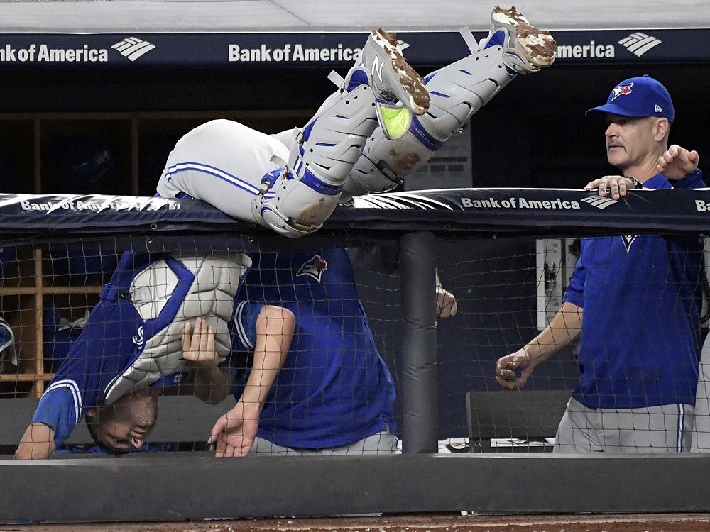 Edwin Encarnacion crashed the Blue Jays dugout in full uniform