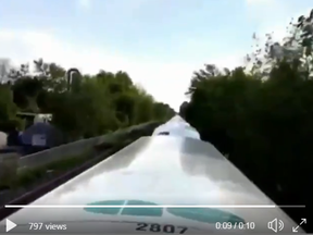 Screengrab of a video uploaded to 6ixBuzzTV Instagram account, which was tweeted out by a Metrolinx employee. The video shows a person riding atop a moving GO Train.