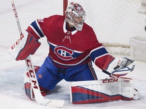 Canadiens goaltender Carey Price makes a glove save against the Canucks during NHL action in Montreal on Jan. 7, 2018.