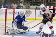 Senators’ Drake Batherson tries to put the puck past Maple Leafs goalie Curtis McElhinney during pre-season action. McElhinney is slated to start one of Toronto’s three remaining pre-season games. (CP FILE)