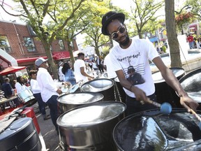 Souls of Steel Orchestra play at Alexander the Great Parkette on Logan Ave. as part of Danforth Strong, helping to heal the community on Sunday (Jack Boland/Toronto Sun)
