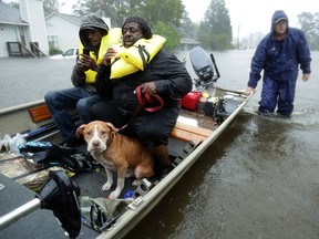 Volunteers from all over North Carolina help rescue residents and their pets from their flooded homes during Hurricane Florence Sept. 14, 2018 in New Bern, N.C.