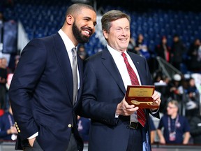Rapper Drake gets the Key to the City from Toronto Mayor John Tory ahead of the NBA Celebrity game at the Ricoh Coliseum in Toronto, Ont. on Friday, Feb. 12, 2016. (Dave Abel/Toronto Sun/Postmedia Network)