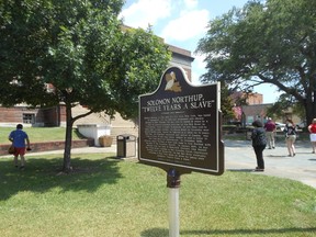A historic marker outside the Avoyelles Parish Courthouse in Marksville, La. explains the area’s connection to Solomon Northup’s story, which was made into a book and movie. (DAVE POLLARD/Postmedia Network)
