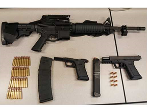 An assault rifle, two handguns and hundreds of rounds of ammunition were seized from an Ajax home on Monday, Sept. 10, 2018 (Durham Regional Police handout)