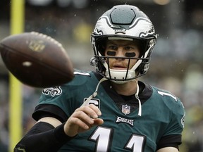 In this Sunday, Sept. 23, 2018 file photo,Philadelphia Eagles quarterback Carson Wentz (11) ahead of an NFL football game the Indianapolis Colts in Philadelphia.