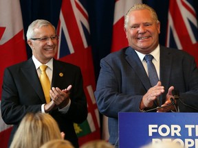 Accompanied by Finance Minister Vic Fedeli, Premier Doug Ford announces his government will seek to create a select committee to investigate Liberal waste and scandal at Queen's Park in Toronto, Ont. on Monday September 24, 2018. Dave Abel/Toronto Sun